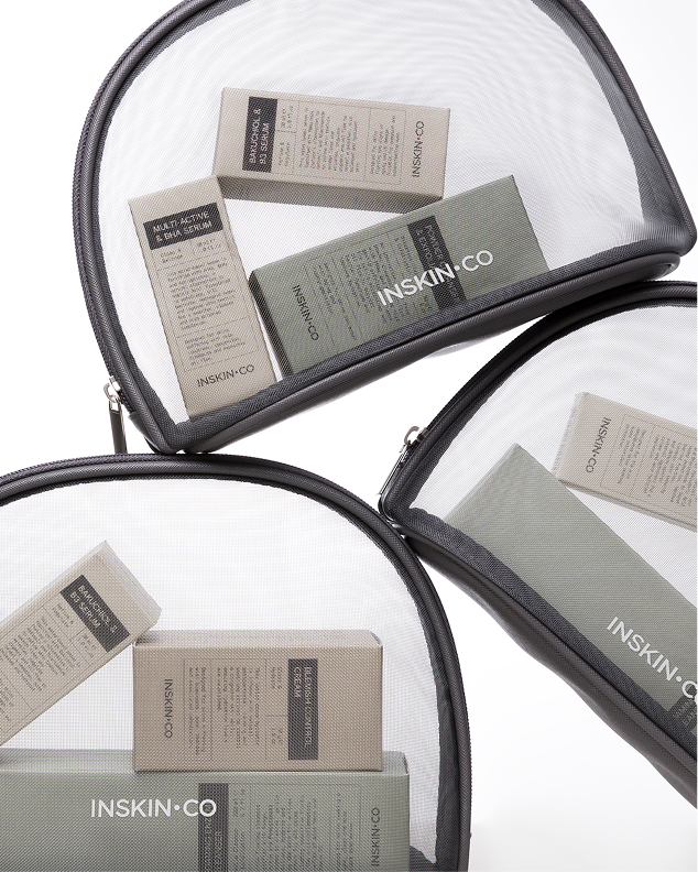 Three clear mesh Inskin Co travel bags holding boxed Bakuchiol & B5, Multi-Active & BHA and Vitamin C serums.