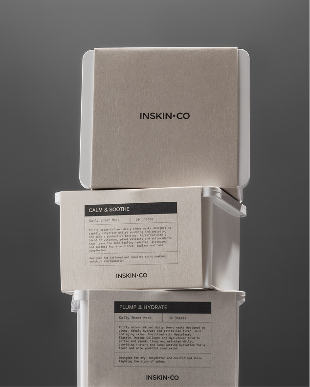 Stack of Inskin Co Calm & Soothe and Plump & Hydrate daily sheet mask boxes, 30 sheets each, on a grey background.